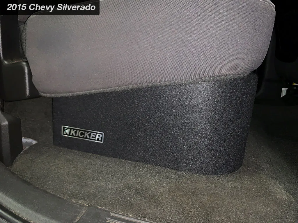 Kicker L7T box fitted under the rear seat of a 2015 Chevy Silverado
