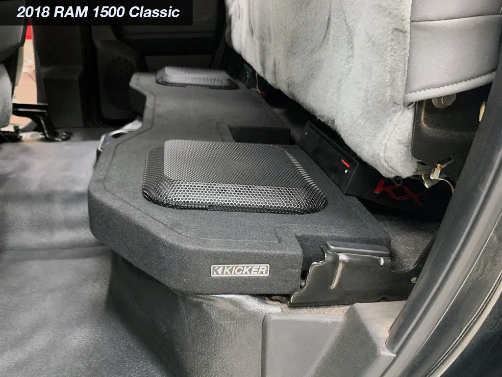 Kicker L7T box with grilles fitted under the rear seat of a 2018 Ram 1500 Classic