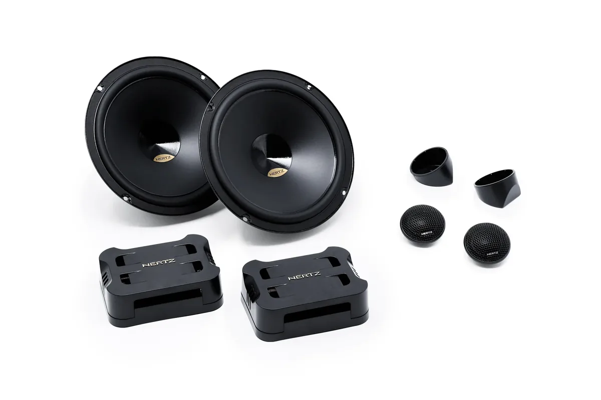 Hertz Dieci DPK 165.3 6.5-inch component set: two woofers, two crossovers, two tweeters and two tweeter cups on white