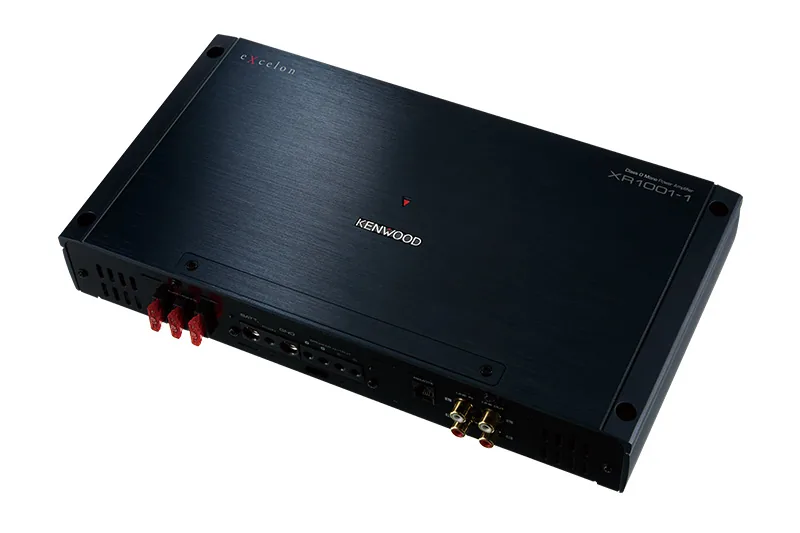 Kenwood eXcelon Reference XR1001-1 mono amplifier, three-quarter view of the black chassis with red speaker terminals